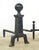 Antique andirons made of cast iron with cannonball style tops and a square column design. Andirons, also known as...