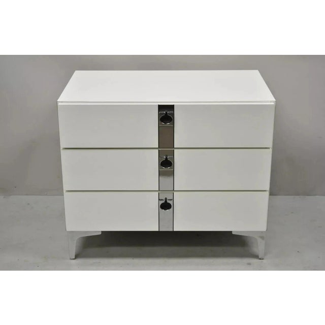 Contemporary Modern White Formica Chrome Trim 3 Drawer Chest Nightstand Table. Item features chrome trim and feet, white...