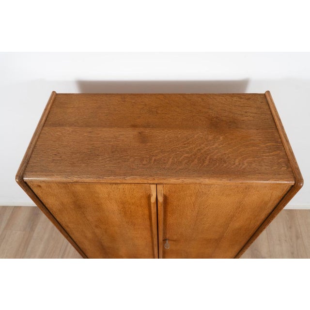 Model CE06 Oak Series Cabinet by Cees Braakman. The cabinet comes with 4 drawers on the the top and two shelves on the...