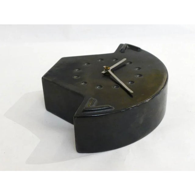 Small midcentury clock to put (also possible to hang it on the wall), beautiful stylized geometric shape: narrow base,...