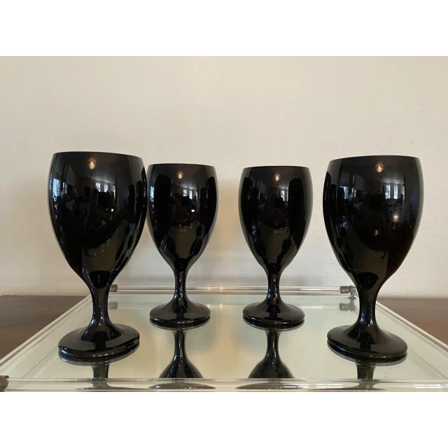 Iconic tear drop goblets by Libbey. These present as black unless you have a lot of light on them, at which they are a...