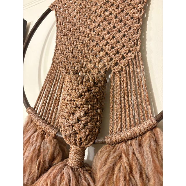 Impressive large-scale vintage macramé wall hanging from the 1970s, mounted on a substantial circular wood hoop. This...