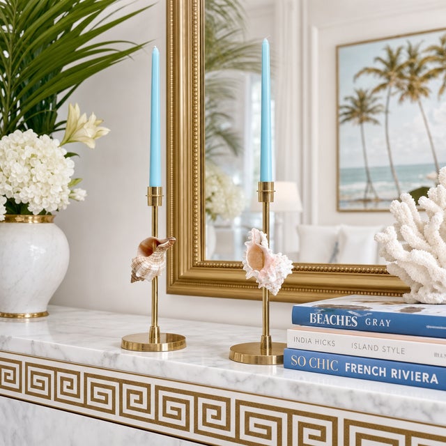 Offering a magnificent pair of restored 11.5" solid brass candlesticks with seashells, circa 1980's. These heavy and...