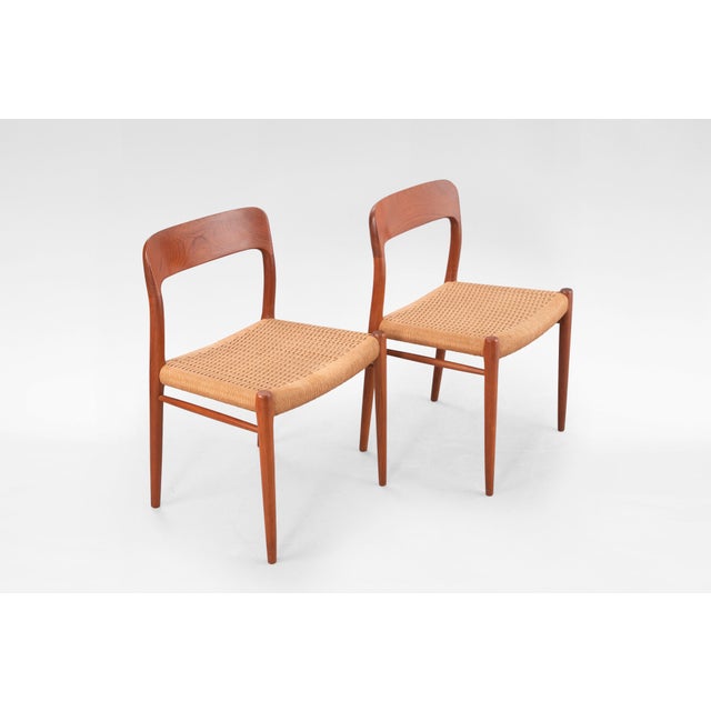 This set of four Model 75 dining chairs by Niels Otto Møller, produced by J.L. Møller Møbelfabrik in Denmark during the...