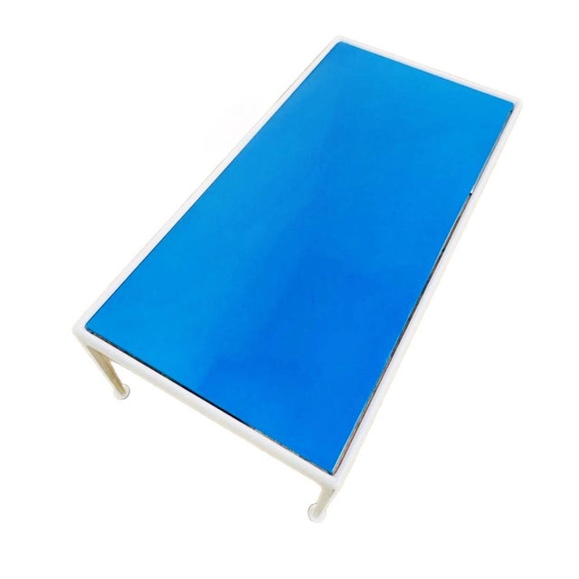 A 1960's outdoor rectangular accent table designed by Richard Schultz for Knoll. The table features a bright blue enamel...
