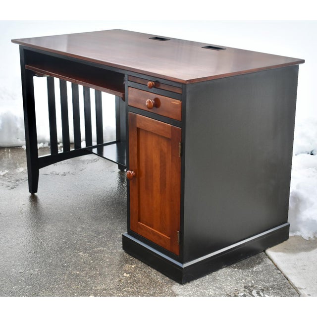 Vintage (1990's) Desk has a Transitional Style. Made by Ethan Allen. The Finish is Black & Reddish Brown. CherryWood. The...