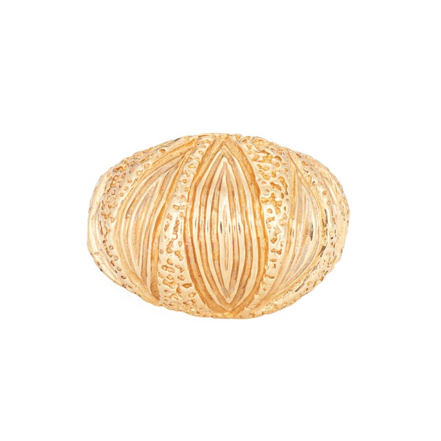Stylish vintage textured dome ring (circa 1970s) crafted in 14k yellow gold. A textured ridged design adorns the domed...