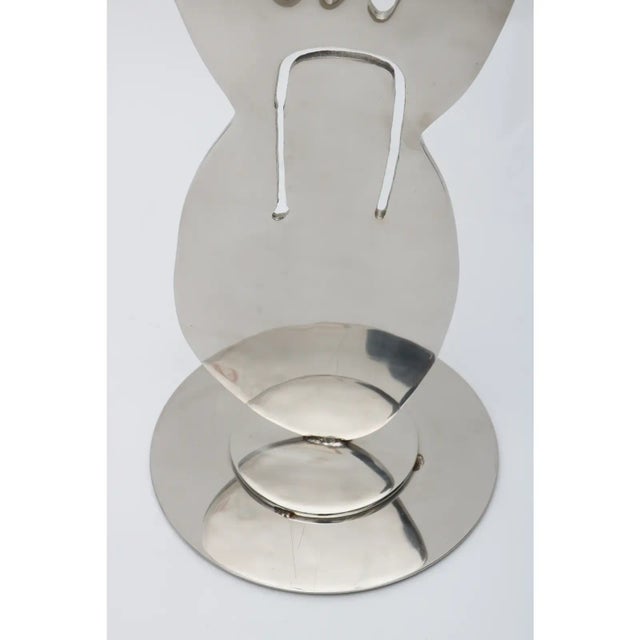 American Sculpture by listed artist Jack Schuyler. Amoeba form in polished steel.