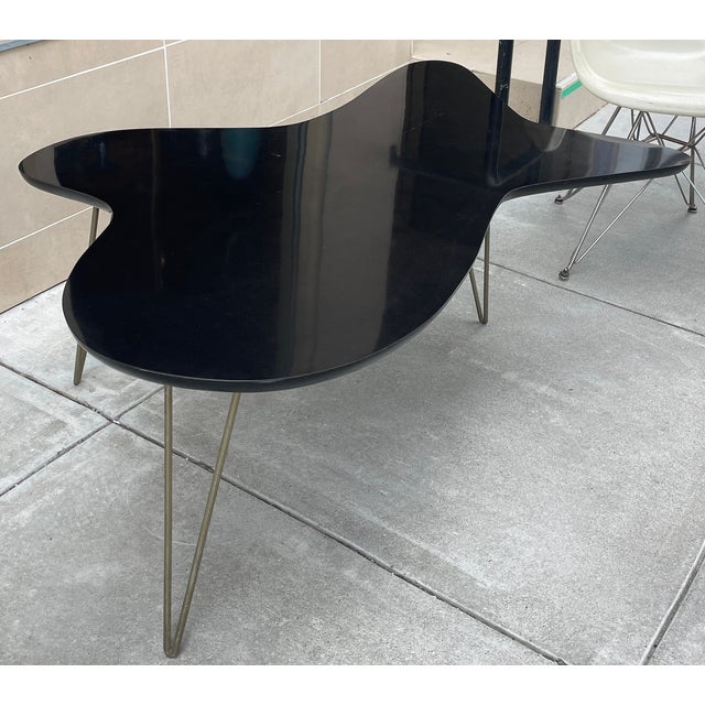 This is a delightfully free form mid century cocktail table that will add instant pizazz to your room. Pairs nicely with...