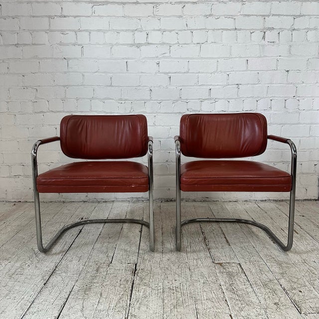 Machine age tubular chrome chairs with real leather upholstery. The cantilevered design provides exceptional comfort