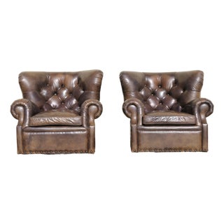Pair of Restoration Hardware Churchill Tufted Leather Swivel Chairs | Vintage Distressed Cigar Leather Wingbacks For Sale