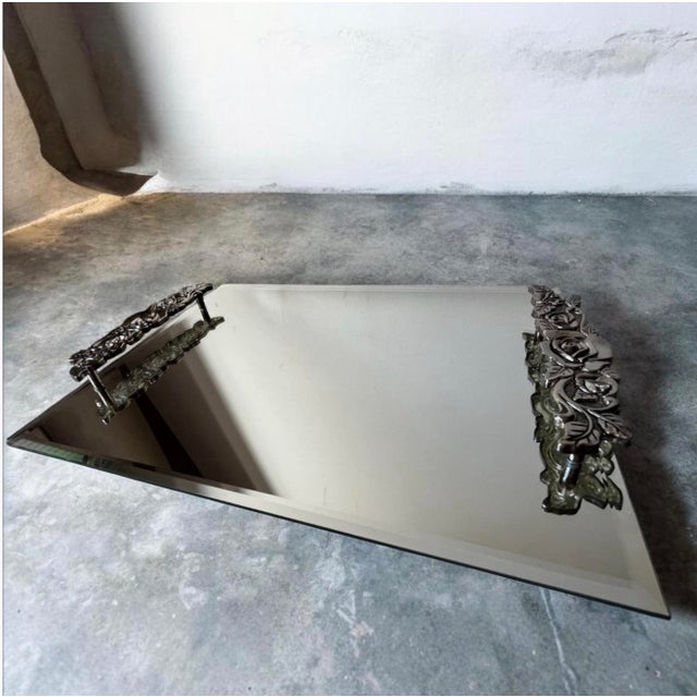 Tray designed with this exact style—featuring thick, heavy pewter or silver-plated handles adorned with three-dimensional...