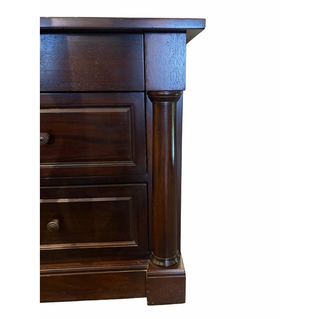 Elevate your bedroom with this timeless, American-made solid wood nightstand crafted by The Michaels Furniture Company...