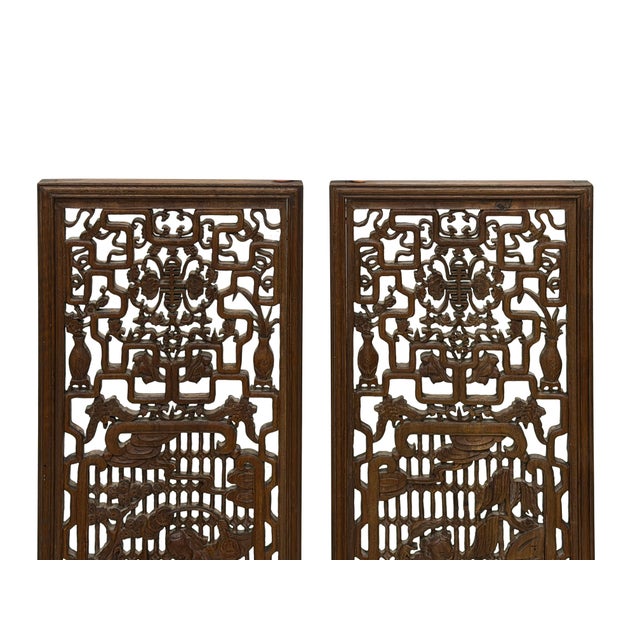 Elevate your interior space with this pair of antique Chinese architectural openwork wood panels, meticulously hand-carved...