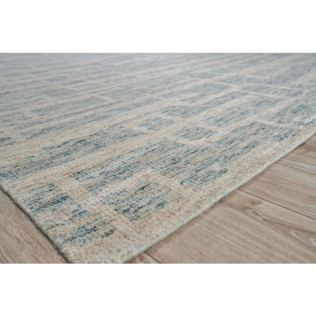 Anchor any room with the rich texture and pattern of the Aldridge rug. Hand-knotted with a luxurious blend of wool and...