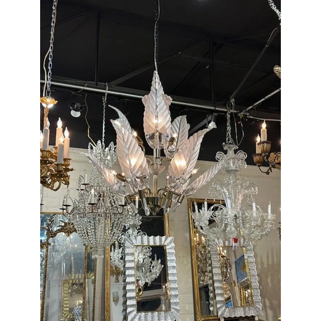 Vintage Murano glass and brass 2-tier leaf chandelier. Circa 1980. The chandelier has been professionally rewired, comes...