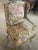 A beautifully handcrafted French Rococo wing chair, upholstered in a luxurious, high-end fabric with bold peony-style...