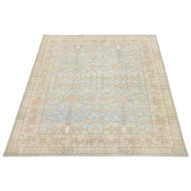 This Modern Khotan Style wool rug reinterprets traditional East Turkestan design with a contemporary color palette....