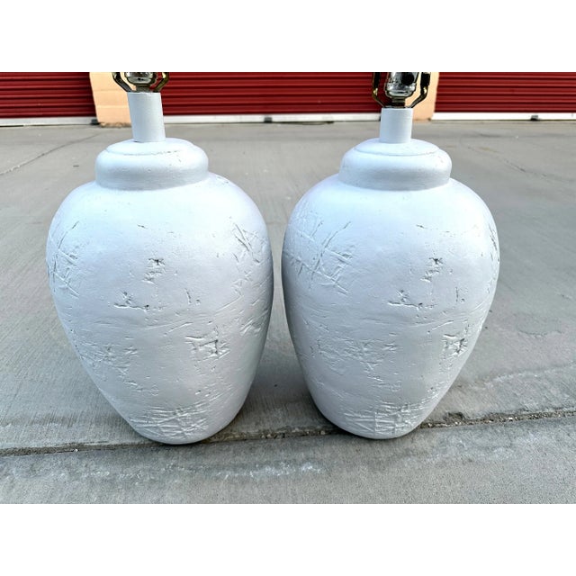 Vintage Pair of Heavy Postmodern Plaster Table Lamps w/Harp and Finials. Textured design throughout. These would also be...