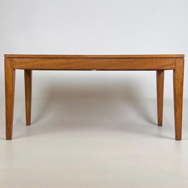 A beautifully made vintage 20th-century coffee table, finely crafted in satinwood and distinguished by its elegant...