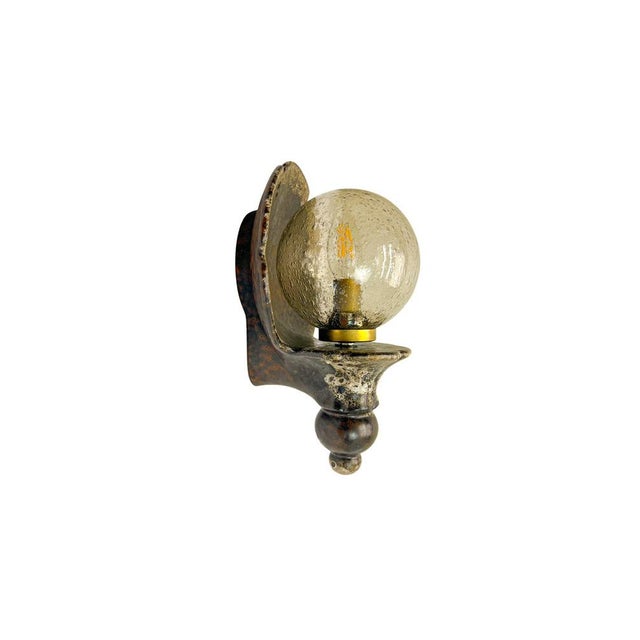 Mid-Century German Fat Lava Ceramic Wall light with a sphere of speckled glass, 1960s In a very good condition. Bulb E14...