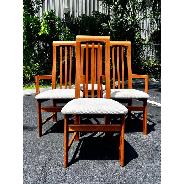 Mid-century modern dining chairs. Set of four with two armchairs by Nordic Furniture. A modern and sleek set of chairs....