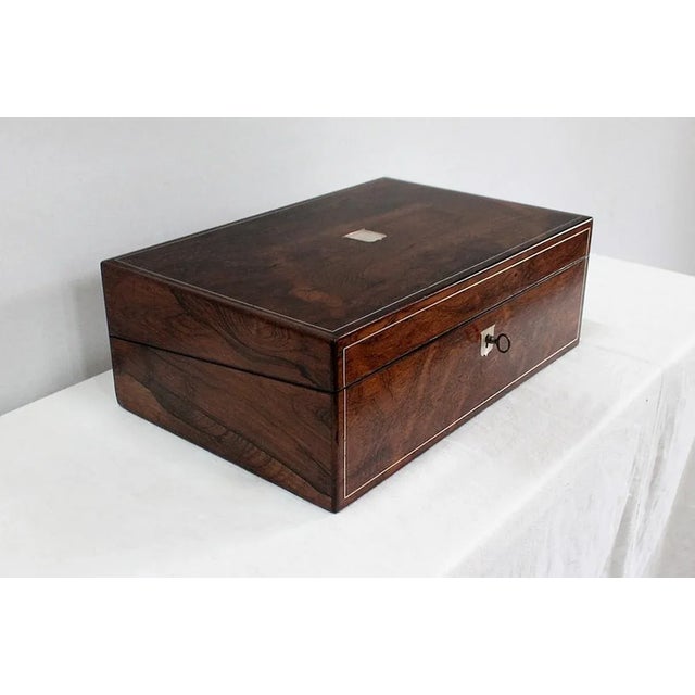 Beautiful writing case signed "Pearce Maker 77 Cornhill London" on an ivory plate. Rectangular in shape, this box is...