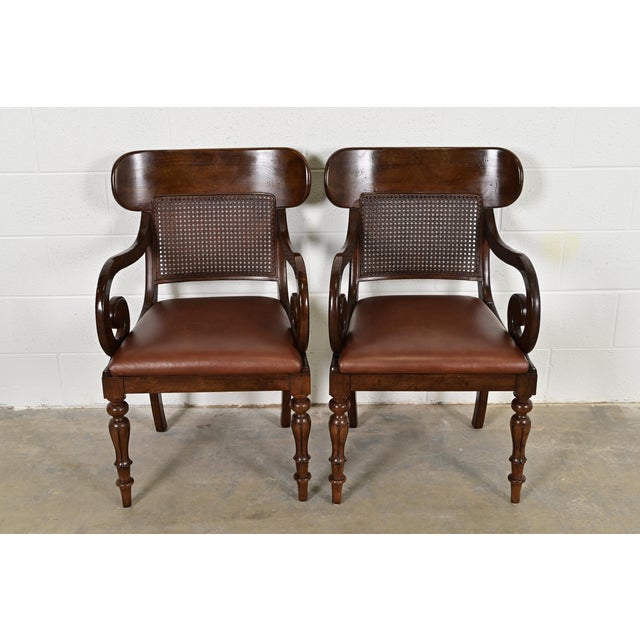 A gorgeous pair of English Regency style armchairs or dining captain chairs By Ralph Lauren for Henredon Circa Late 20th...