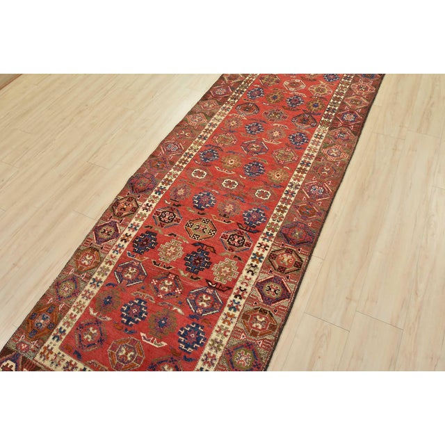 This authentic semi-antique tribal Meshkin runner is hand-knotted with fine wool and natural dyes. This nomadic oriental...
