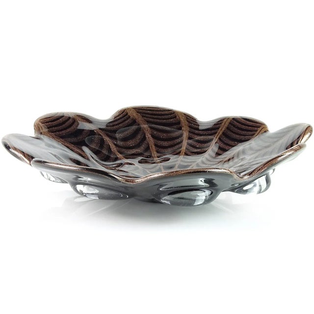 Beautiful large vintage Murano hand blown black with copper aventurine Italian art glass centerpiece bowl. The piece has a...