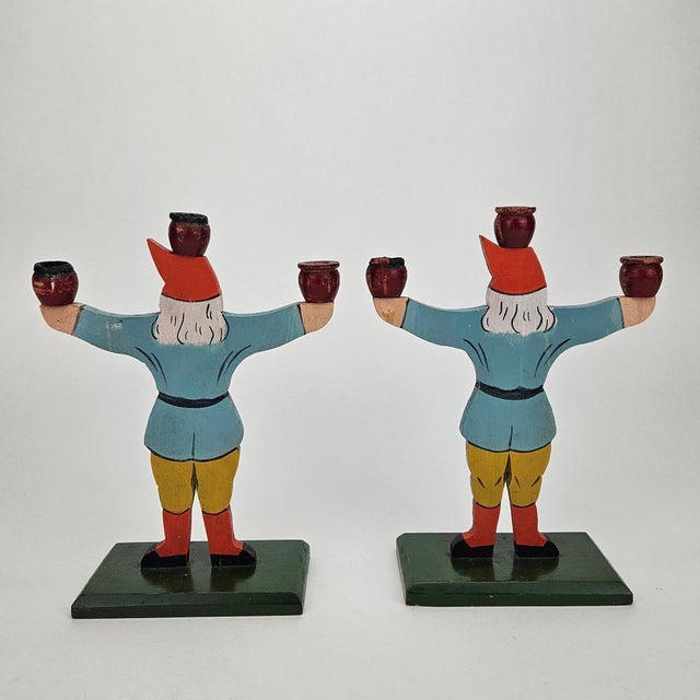 Two candlesticks made of painted wood from the turn of the century (1900). Crafted and painted by hand. Both have two...