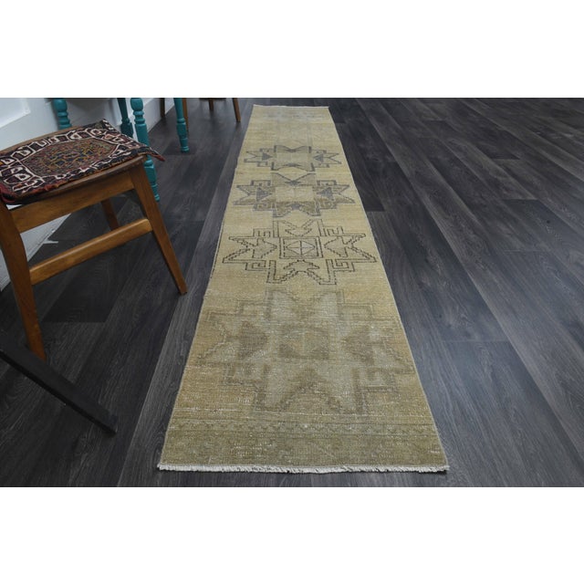 Vintage Hand-Knotted area rug is a semi-antique vintage area rug. The '70s Eastern region of Anatolia's unique rug is...