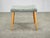 A charming Danish Mid-Century Modern upholstered stool dating from the 1960s. The stool features a softly contoured...