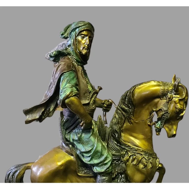 This Vintage Barye Attributed "Arab Warrior On Horse" Bronze Sculpture is a stunning piece of art. The sculpture stands at...