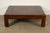 A gorgeous mid-century modern Hollywood Regency or Chinoiserie leather wrapped coffee table or cocktail table By Maitland...