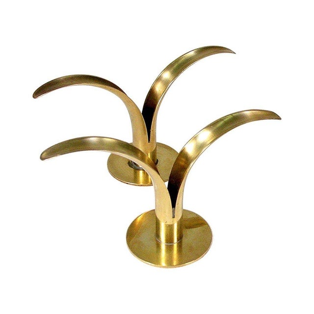 This set of Classic, Mid-Century "Lily" candle holders in brass was designed by Ivar Alenius Bjork for Ystad Metal in...