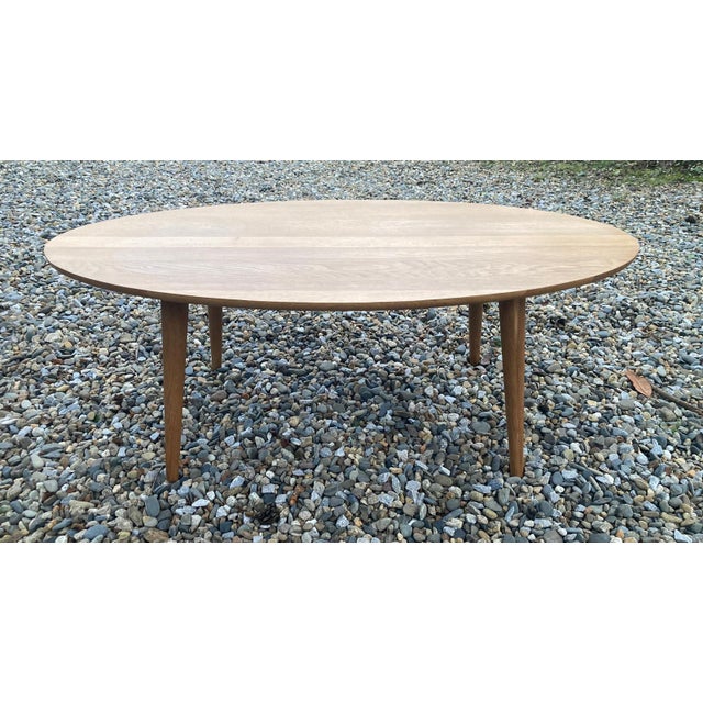 Beautiful 1960s table. Tender tapered legs. French craftsmanship. Made of light oak, waxed finish.