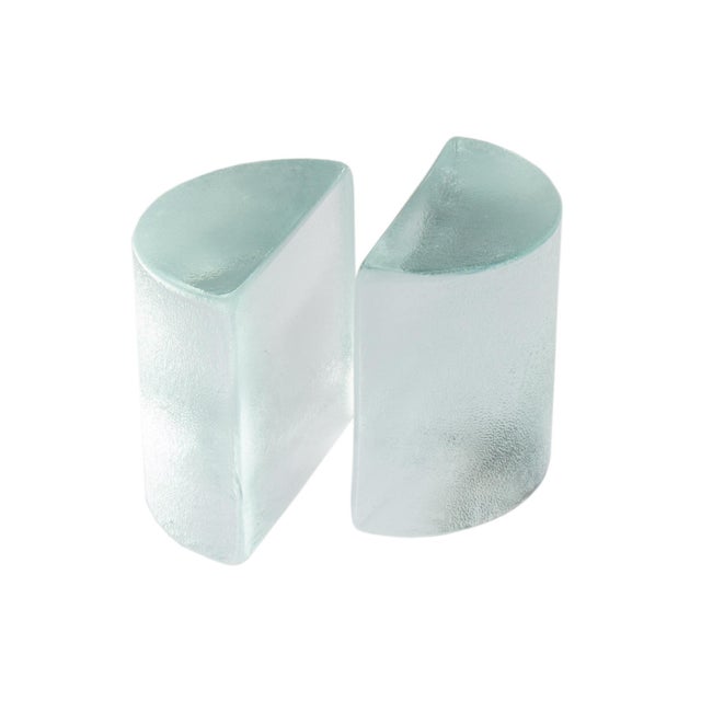 A pair of vintage "Half Moon" bookends designed by Wayne Husted for Blenko. This iconic solid glass bookend pair are each...
