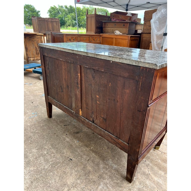 This elegant French 19th-century Louis XVI chest of drawers is crafted in rich mahogany, featuring a classic rectangular...