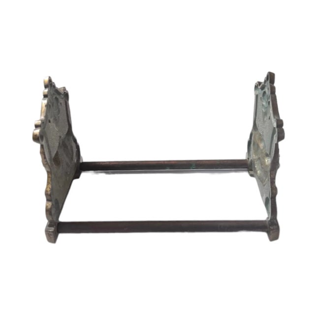 An antique, Victorian brass tabletop book rack or extendable bookends, with ornate flower garland designs. 5"x5.5"x8.5" to...