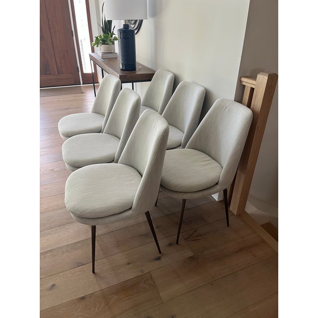 Like New! Six Finley low-back dining chairs from West Elm. Delivered on February 24, 2026. Comfortable and lovely chairs....