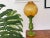 The body is made of wood lacquered green, the globe is in semi-frosted amber glass. Has original bulb holder made of brass...