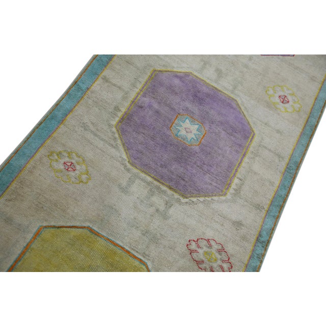 Introducing a one-of-a-kind vintage Turkish hand-knotted wool rug, carefully crafted by skilled artisans using traditional...