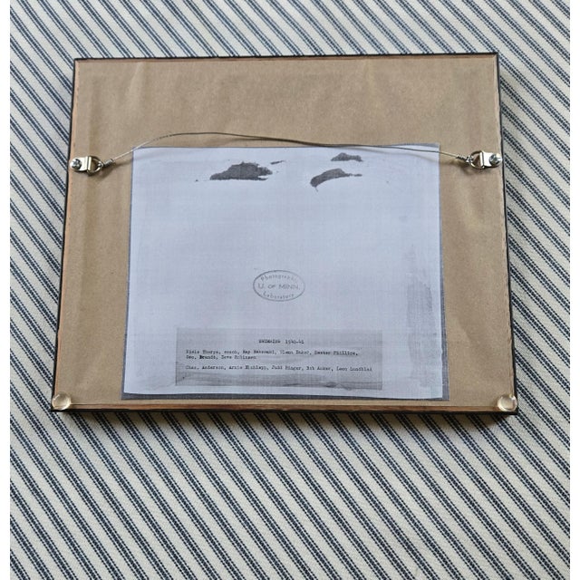 One of a series of antique University of Minnesota athletics team photographs. This is the U of M Men's Swimming Team of...