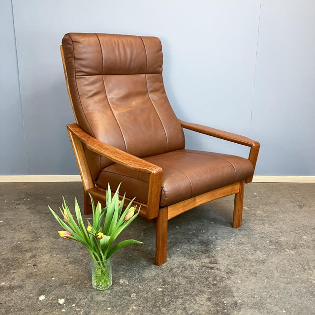 A striking high-back armchair in the Danish mid-century design style – exceptionally well-made and incredibly comfortable....
