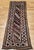 A beautiful and colorful vintage Caucasian Gendje Kazak runner from the late 1800s in excellent pile condition, featuring...