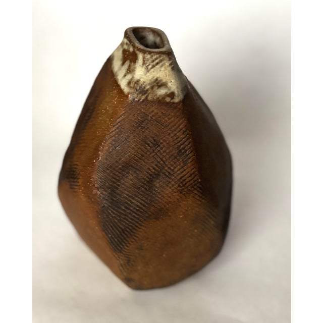 A striking vintage studio pottery vase by Ruth Batkin, signed “Ruth Batkin” on the underside. The vessel has a compact,...