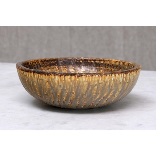 This stoneware bowl was designed by Gunnar Nylund and produced in Sweden in the late 1960s. Nylund designed many classics...