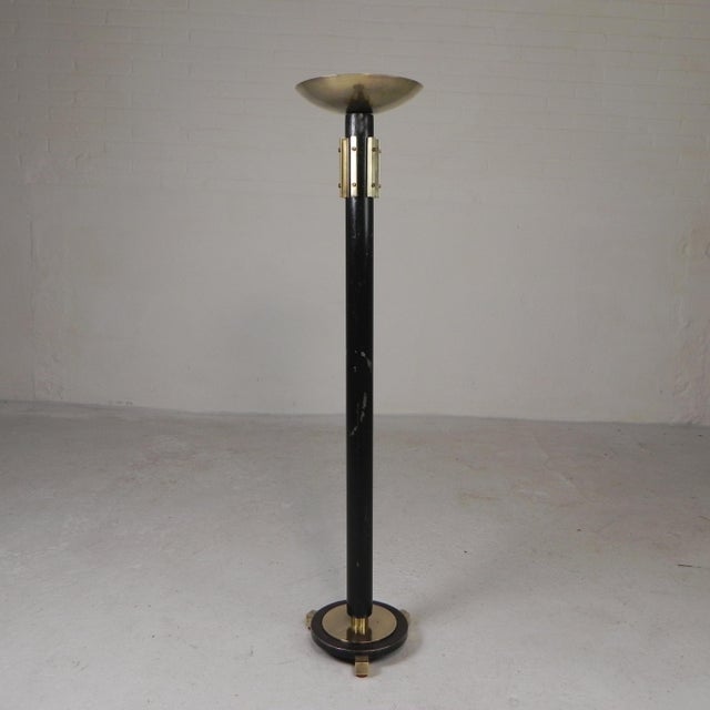Stylish, large standing candlestick from the 1930s. Made of steel with refined brass elements, creating a beautiful...