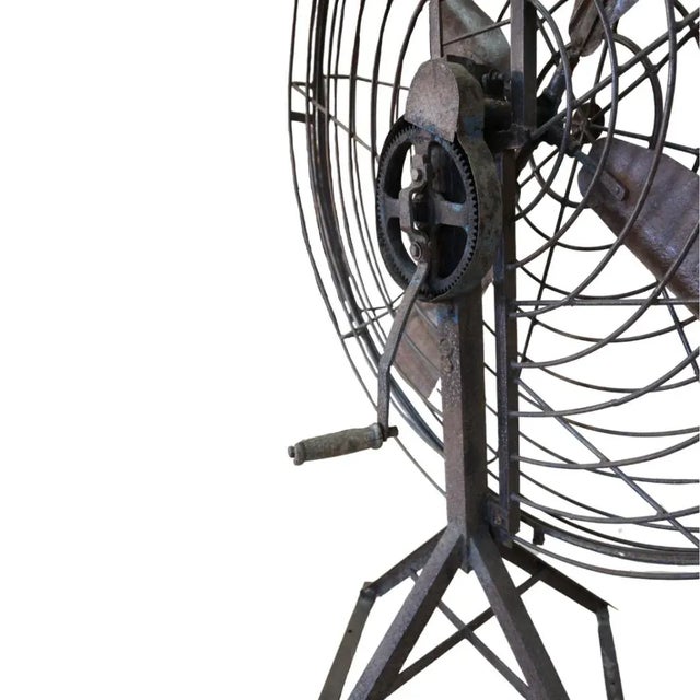 The antique huge fan, equipped with a functioning lever to power the machine, dates back to around 1930 and was originally...
